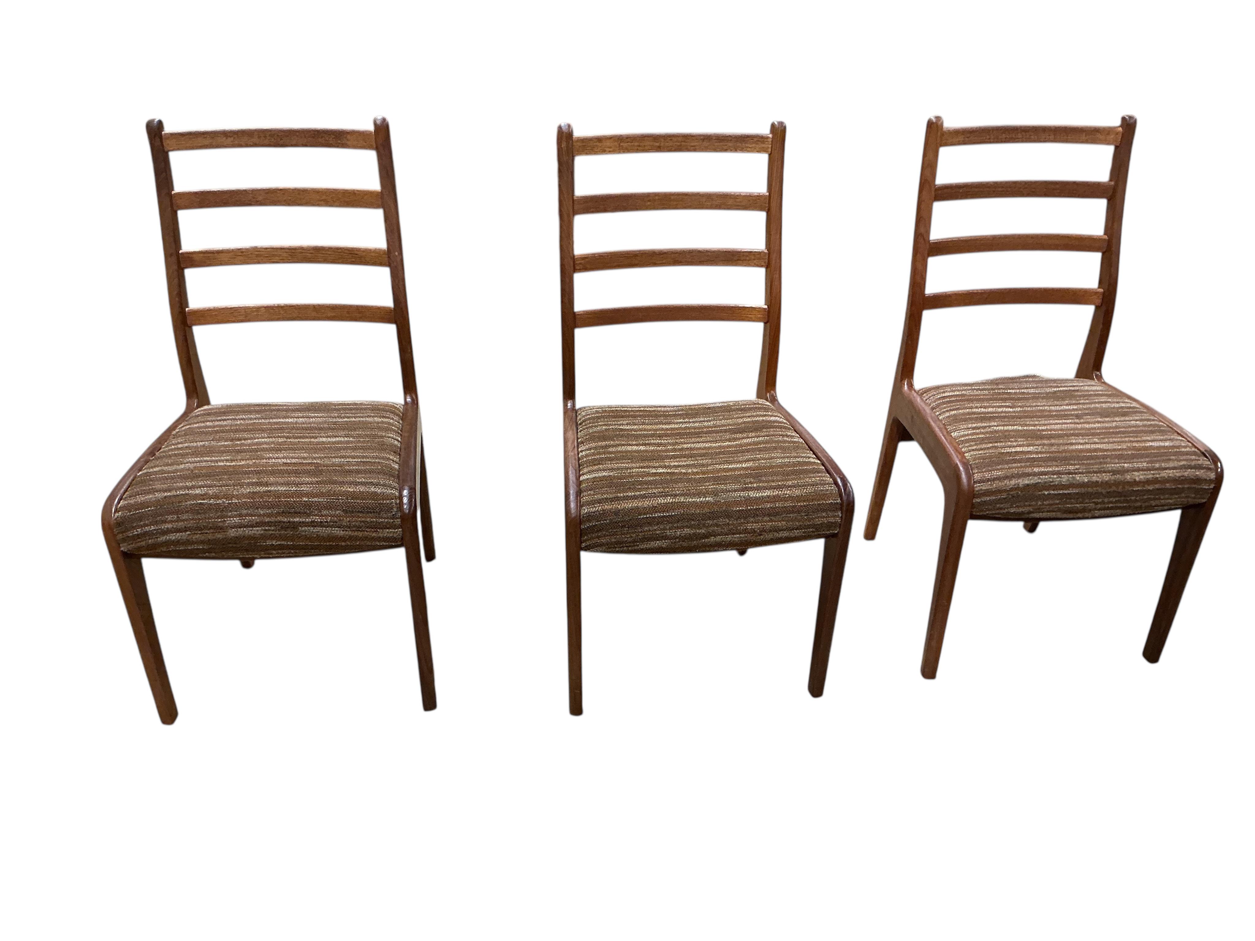A mid century G plan teak extending dining table, width 162cm, depth 106cm, height 72cm together with a set of six chairs